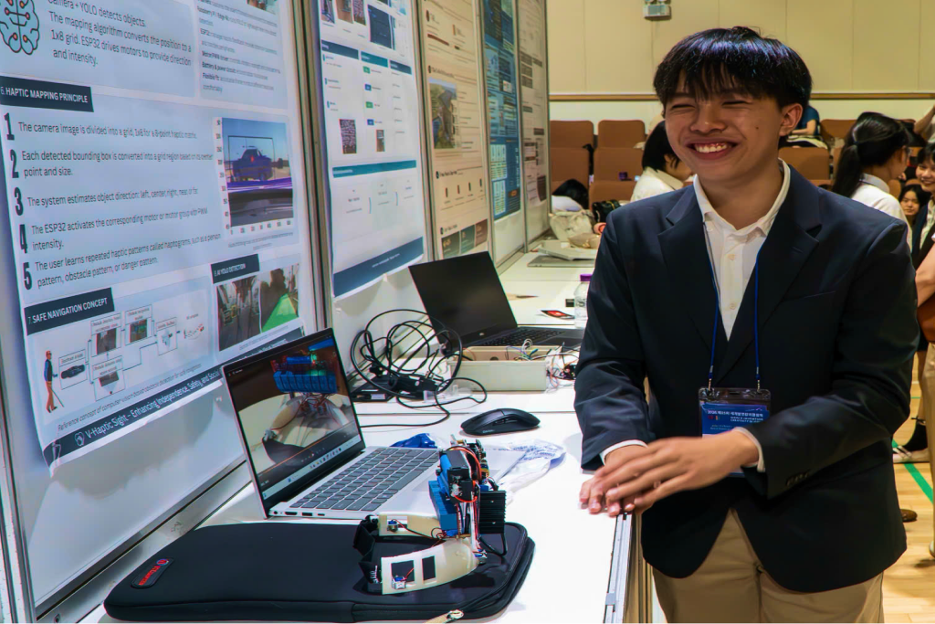 Khoi demonstrating the completed prototype at a project exhibition.