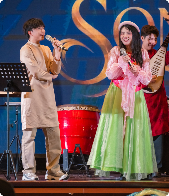 Khoi performing with fellow musicians on stage