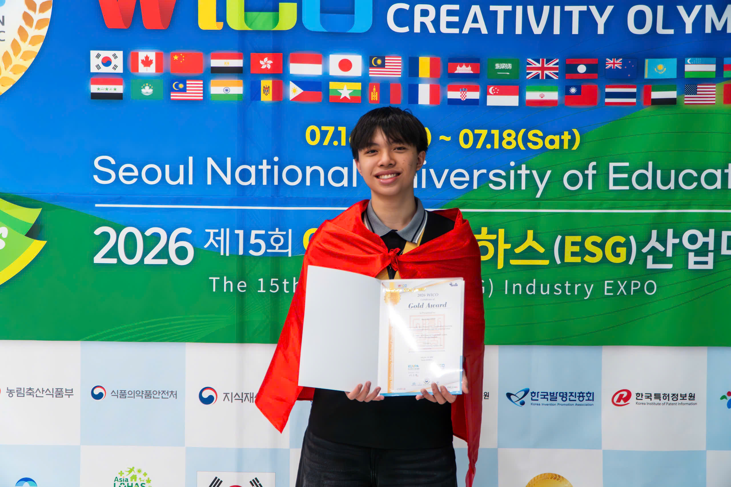 Khoi holding an award certificate at a school event